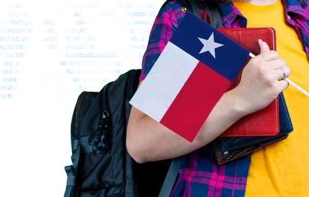 student-holding-texas-flag